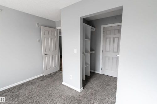 Interior room featuring grey carpeting, light grey wall paint, and white trim - 4407 23 Street, Edmonton, AB - Indoor