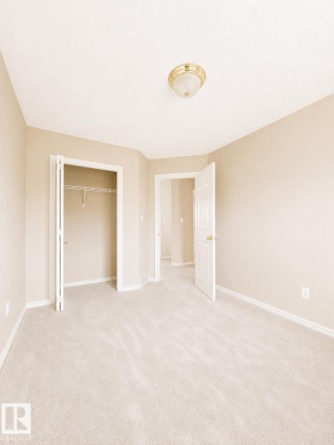 Neutral-toned room with plush carpeting - 704 83 Street, Edmonton, AB - Indoor Photo Showing Other Room