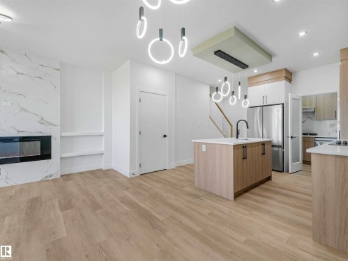 731 30 Street, Edmonton, AB - Indoor Photo Showing Kitchen With Fireplace
