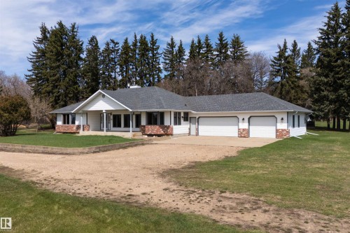 Ranch-style residence featuring white siding and red brick accents - 19403 Fort Road, Edmonton, AB - Outdoor With Facade