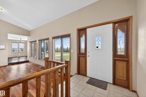 Entryway featuring a white door with decorative glass, flanked by wooden side panels with etched glass - 19403 Fort Road, Edmonton, AB - Indoor Photo Showing Other Room