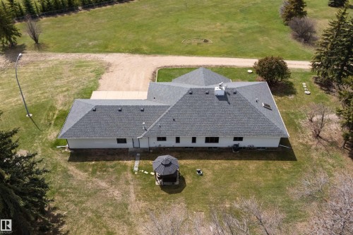 Expansive property featuring a white exterior, gray shingle roofing, and multiple windows - 19403 Fort Road, Edmonton, AB - Outdoor