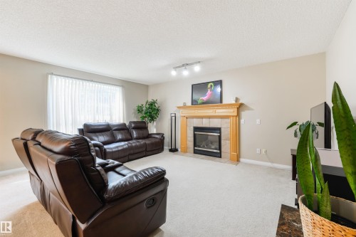 1215 Ormsby Lane, Edmonton, AB - Indoor Photo Showing Living Room With Fireplace