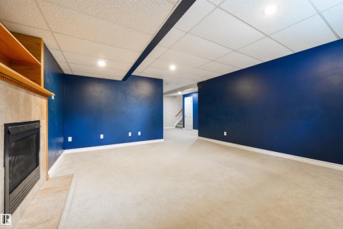 1215 Ormsby Lane, Edmonton, AB - Indoor Photo Showing Other Room With Fireplace