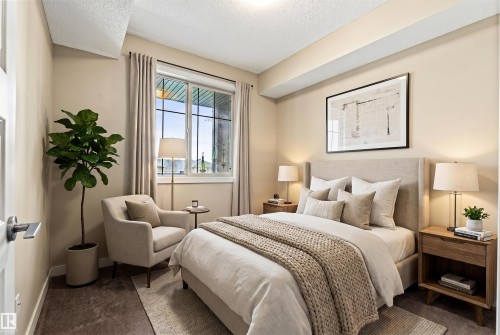Bedroom featuring a window with integrated grille, carpeted flooring, and neutral wall tones - 316 10520 56 Avenue Nw, Edmonton, AB - Indoor Photo Showing Bedroom