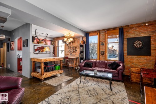 204 10141 95 Street, Edmonton, AB - Indoor Photo Showing Living Room With Fireplace