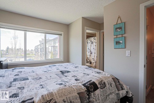 Master Bedroom Very Bright room featuring a large window, neutral wall paint, and textured ceiling - 1622 33A Street Nw, Edmonton, AB - Indoor Photo Showing Bedroom