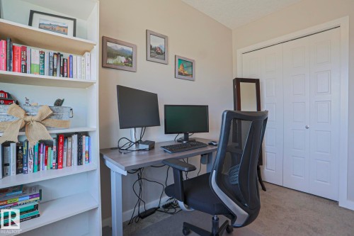 Built-in shelving unit providing extensive storage with lots of room - 1622 33A Street Nw, Edmonton, AB - Indoor Photo Showing Office