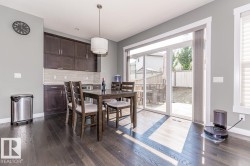 Dark wood-finish flooring complements the grey wall paint - 