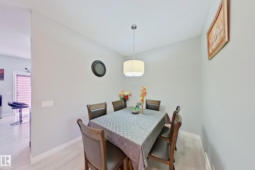 Dining area featuring light-toned wood-finish flooring - 1221 27 Street, Edmonton, AB - Indoor Photo Showing Dining Room