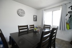 Townhomes often lack a large eating area.  Not here.  This unit features a large, family sized dining room, that easily supports a proper, family sized table.  A large window also looks out into the private yard and patio area - 
