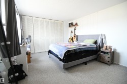 The master bedroom easily supports king sized furniture, thanks to it's generous floor space.  The full wall of floor to ceiling closets is a nice touch, and provides ample storage - 