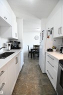 Recent renovations to both bathrooms in the home, as well as the kitchen, are standouts here.  White shaker cabinetry, solid surface counters, undermount sink, tile backsplash, a full sized pantry and more - 