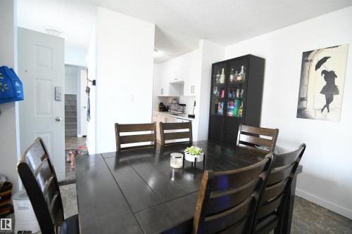 Townhomes often lack a large eating area.  Not here.  This unit features a large, family sized dining room, that easily supports a proper, family sized table.  A large window also looks out into the private yard and patio area - 5823 Riverbend Road, Edmonton, AB - Indoor Photo Showing Dining Room