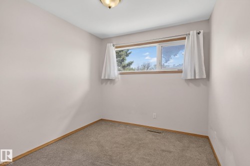 Bedroom featuring neutral carpeting and light-toned wall finishes - 13412 108 Street, Edmonton, AB - Indoor Photo Showing Other Room
