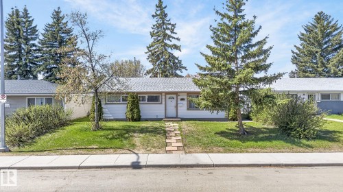 Single-story residence featuring white siding and a light-colored roof - 13412 108 Street, Edmonton, AB - Outdoor