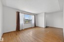 Spacious living area featuring expansive wood-finish flooring - 13412 108 Street, Edmonton, AB  - Indoor 