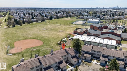 Aerial perspective showcasing residential buildings with a pitched roofline - 18 17409 95 Street, Edmonton, AB - Outdoor With View