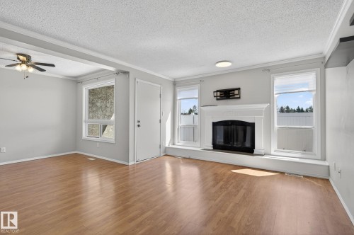 Living room - 18 17409 95 Street, Edmonton, AB - Indoor Photo Showing Living Room With Fireplace