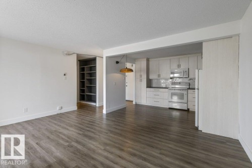 Open-concept living space; Carpet-Free Condo! - 101 8604 Gateway Boulevard, Edmonton, AB - Indoor Photo Showing Kitchen