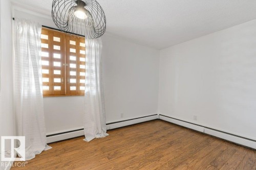 101 8604 Gateway Boulevard, Edmonton, AB - Indoor Photo Showing Other Room
