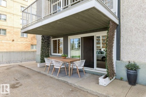 Private patio space featuring a concrete surface - 101 8604 Gateway Boulevard, Edmonton, AB - Outdoor With Deck Patio Veranda With Exterior