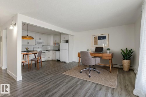 Open-concept living space - large enough for both office & living room area - 101 8604 Gateway Boulevard, Edmonton, AB - Indoor