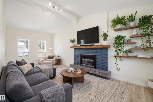 4207 113 Street, Edmonton, AB - Indoor Photo Showing Living Room With Fireplace