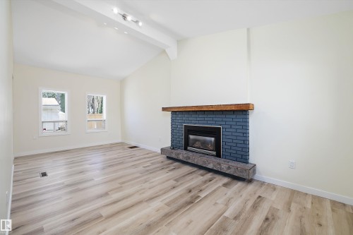 4207 113 Street, Edmonton, AB - Indoor Photo Showing Living Room With Fireplace