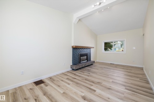 4207 113 Street, Edmonton, AB - Indoor Photo Showing Living Room With Fireplace