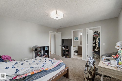 Carpeted room with light gray walls, featuring a flush-mount ceiling light - 1211 29 Street, Edmonton, AB - Indoor Photo Showing Bedroom