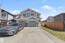 Modern two-story duplex featuring gray siding and stone accents - 1211 29 Street, Edmonton, AB  - Outdoor 