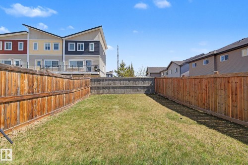 Fenced backyard featuring a grassy lawn and wood fencing - 1211 29 Street, Edmonton, AB - Outdoor