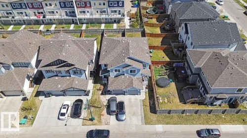 Aerial perspective showcasing a residential property with a multi-gabled roof and a light blue exterior - 1211 29 Street, Edmonton, AB - 