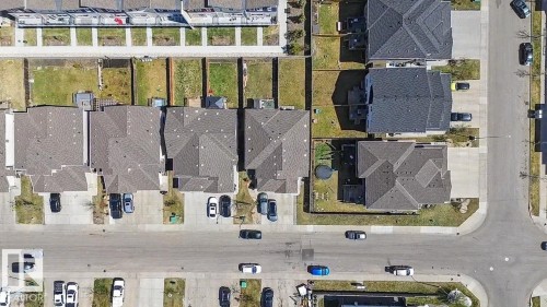 Aerial perspective of a developed residential area featuring multiple single-family homes and townhomes - 1211 29 Street, Edmonton, AB - Other