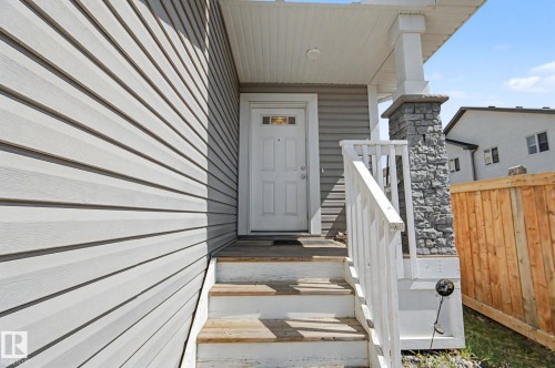Front entry with white door featuring decorative glass insert - 1211 29 Street, Edmonton, AB - Outdoor