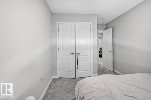 Room featuring gray wall paint, white trim, and gray carpet flooring - 7056 182 Avenue, Edmonton, AB - Indoor Photo Showing Bedroom