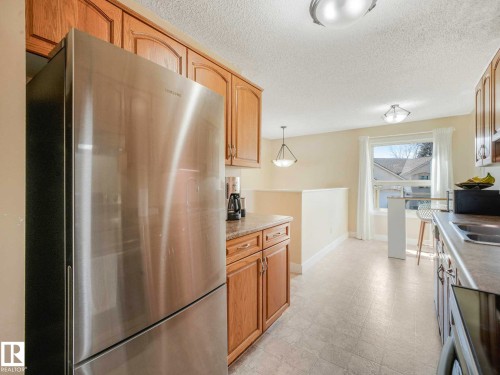 1809 Mill Woods Road E, Edmonton, AB - Indoor Photo Showing Kitchen With Stainless Steel Kitchen With Double Sink