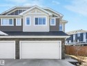 Contemporary facade featuring horizontal siding and dark stone veneer accents - 3817 Robins Crescent, Edmonton, AB  - Outdoor 