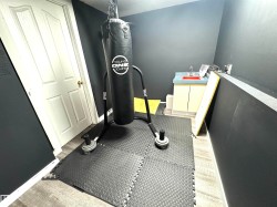 Workout room featuring baseboards - 
