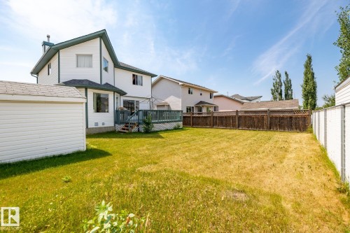 Fenced backyard with a deck - 6734 162A Avenue, Edmonton, AB - Outdoor With Deck Patio Veranda
