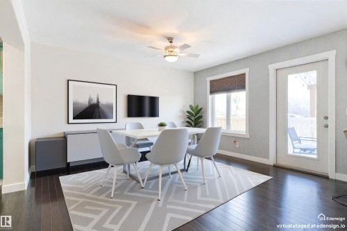 Virtually stagged. Dining area with dark wood-finish flooring, a ceiling fan, and light gray textured accent wall - 4914 47 Street, Redwater, AB - Indoor