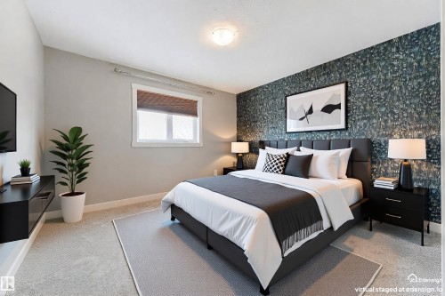 Accent wall with textured metallic wallpaper - 4914 47 Street, Redwater, AB - Indoor Photo Showing Bedroom