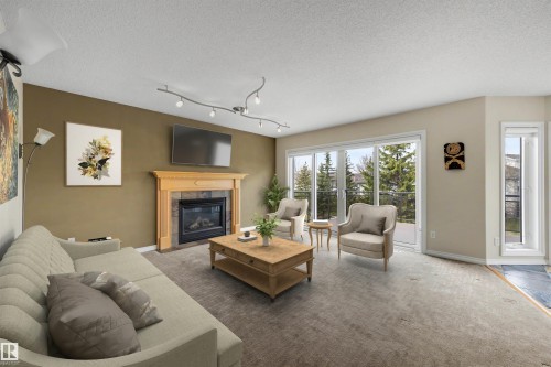 223 Ormsby Road E, Edmonton, AB - Indoor Photo Showing Living Room With Fireplace