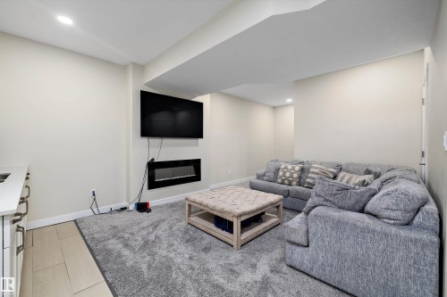 504 Sturtz Link, Leduc, AB - Indoor Photo Showing Other Room With Fireplace