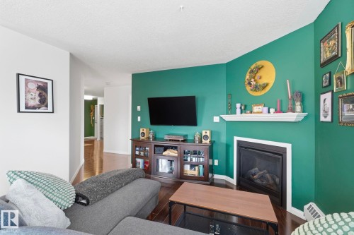 204 10827 85 Avenue, Edmonton, AB - Indoor Photo Showing Living Room With Fireplace