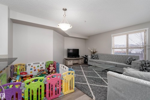 117 3207 James Mowatt Trail, Edmonton, AB - Indoor Photo Showing Living Room