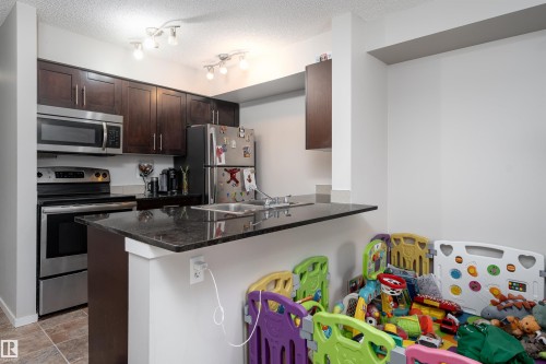 117 3207 James Mowatt Trail, Edmonton, AB - Indoor Photo Showing Kitchen With Stainless Steel Kitchen With Double Sink