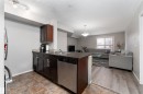 117 3207 James Mowatt Trail, Edmonton, AB  - Indoor Photo Showing Kitchen With Double Sink 