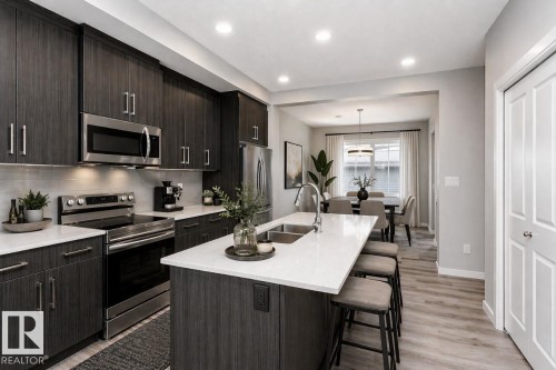 314 Hawthorn Way, Leduc, AB - Indoor Photo Showing Kitchen With Double Sink With Upgraded Kitchen